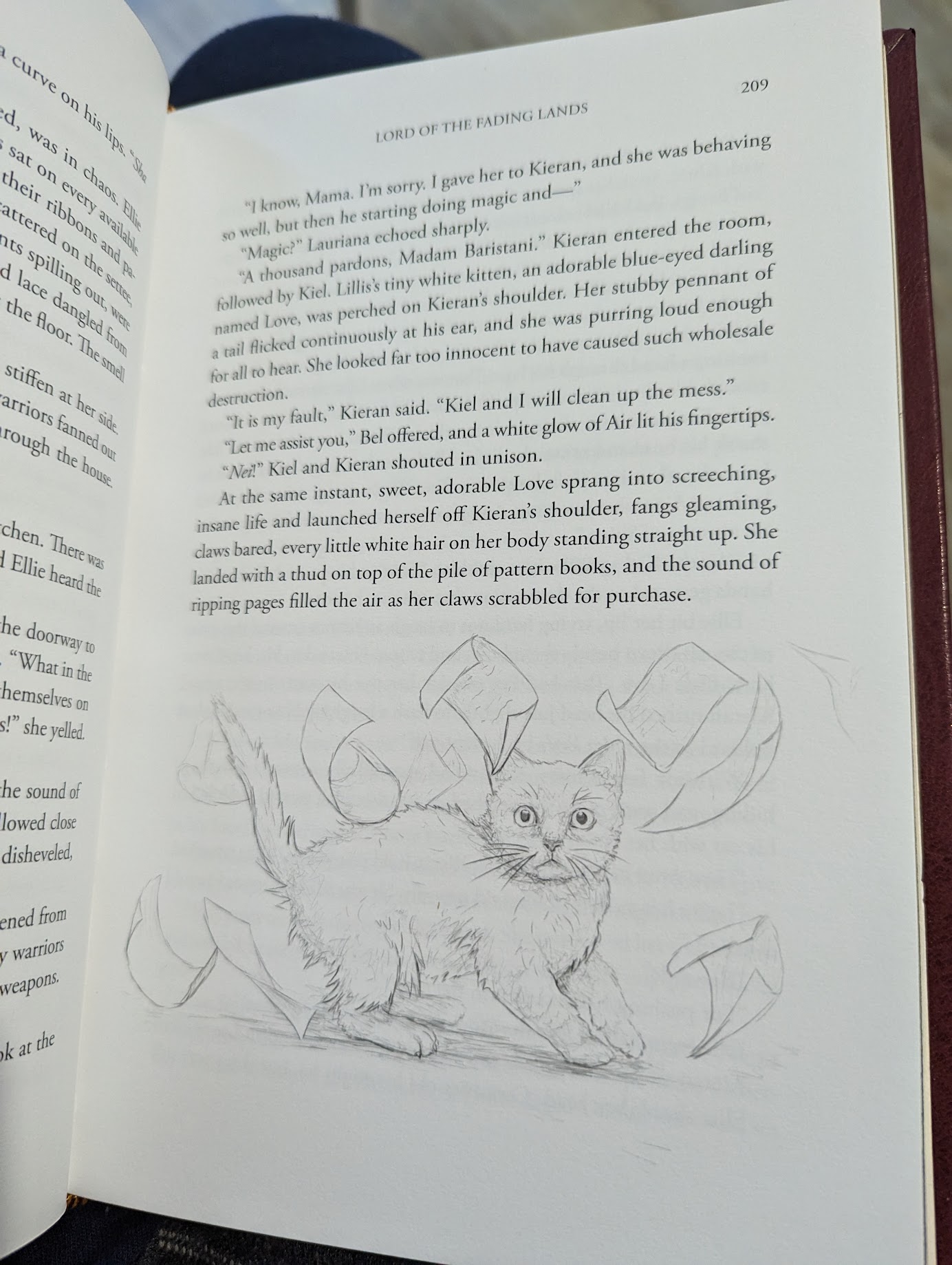 Photo of the interior page of a book. At the end of the page is a rough sketch of a cat looking alarmed. There are papers flying all around it, as if the cat had just disrupted them in their fright.